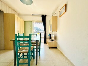Enjoy meals in this cozy dining area with a long table and comfortable seating for a relaxing meal.