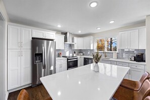 Fridge, microwave, oven, stovetop - Mid-Century Modern Retreat Home in Overland Park - Full Home (Overland Park)