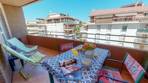 Enjoy a morning meal on the balcony with a view of the surrounding neighborhood.