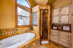 Jetted tub, hair dryer, towels, soap
