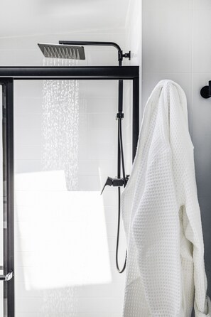 Shower, hair dryer, towels, soap