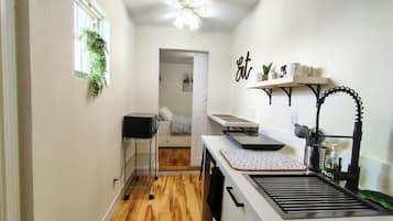 Fridge, microwave, stovetop, coffee/tea maker