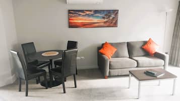 One Bedroom Executive | Living area | 32-inch LCD TV with satellite channels
