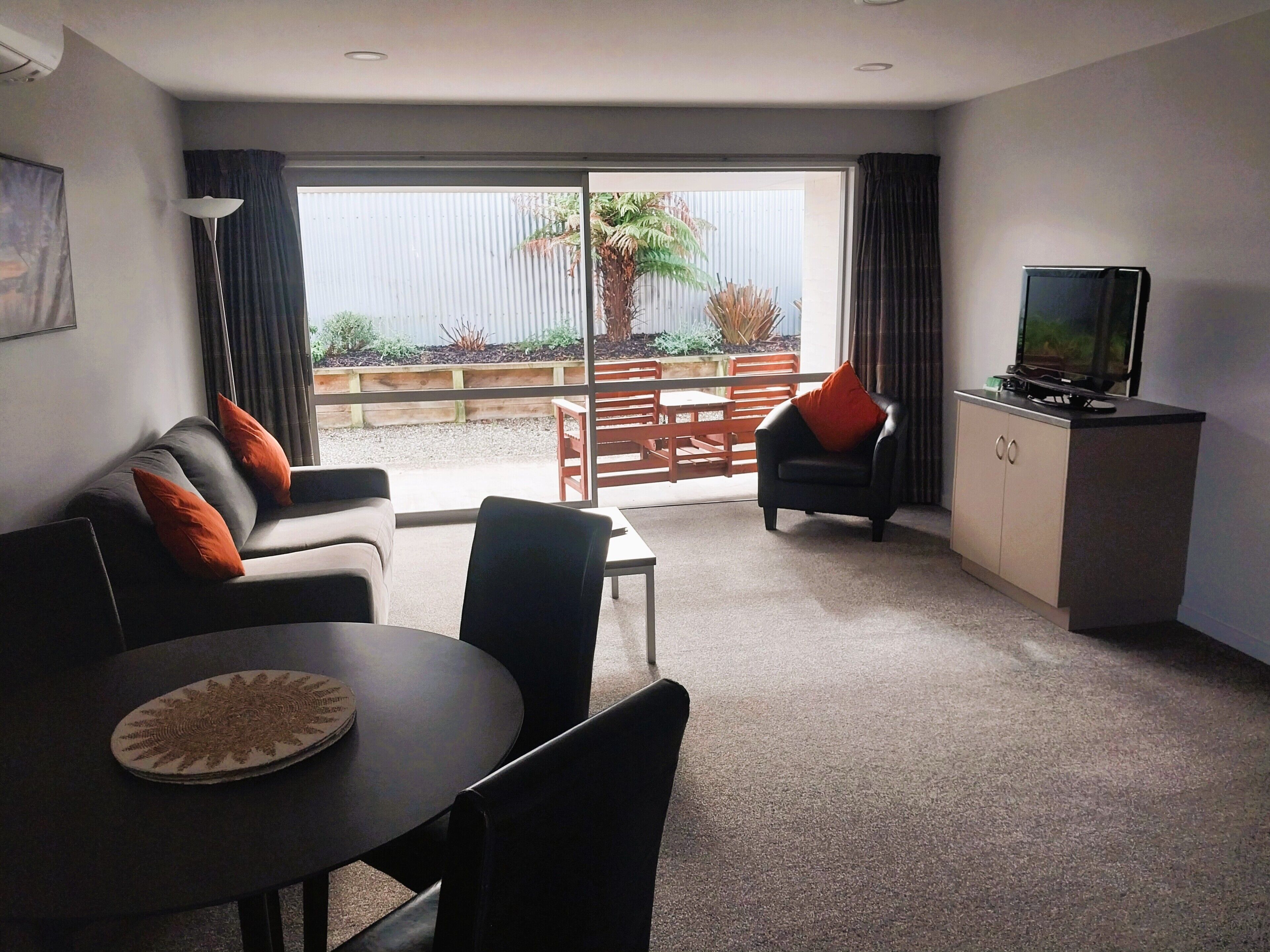 One Bedroom Executive | Living area | 32-inch LCD TV with satellite channels