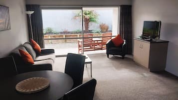 One Bedroom Executive | Living area | 32-inch LCD TV with satellite channels