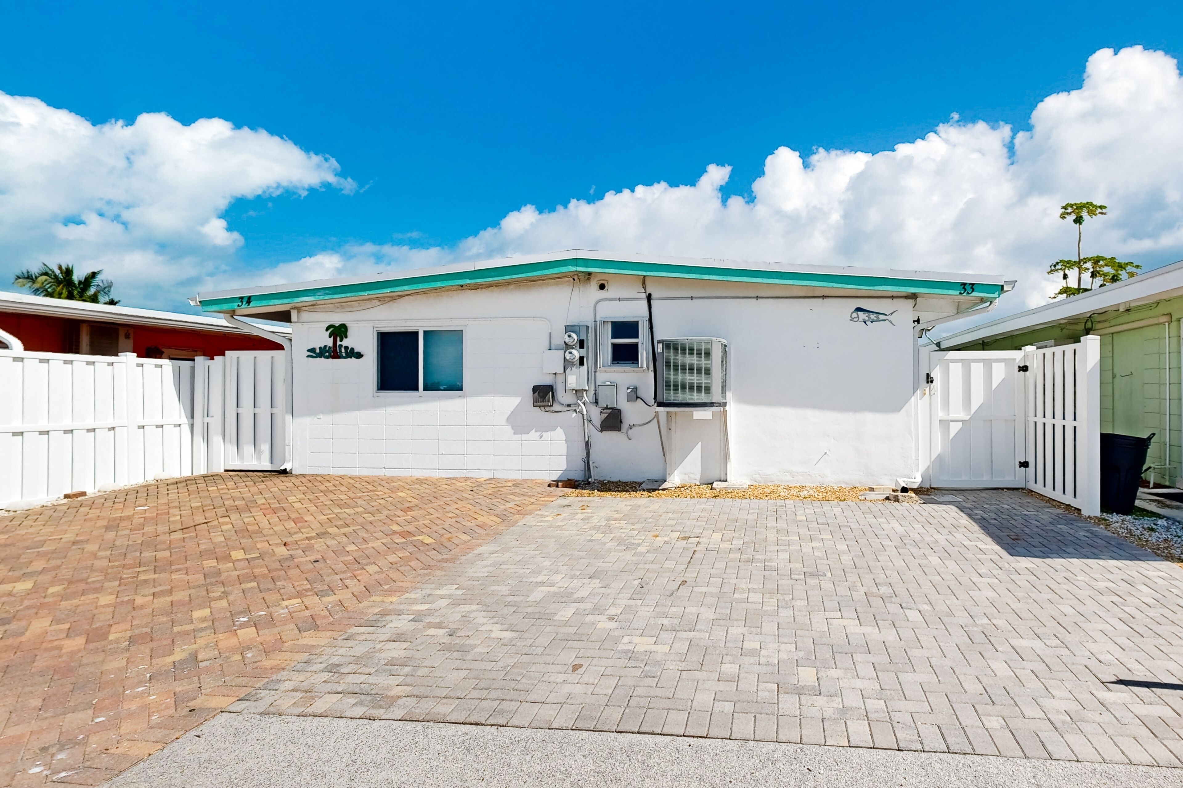 Oceanfront island duplex with dock access, kayak, bikes, grill, games, W/D, & AC