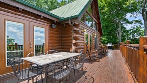 Enjoy meals on the deck with a grill and dining table.