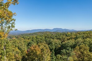 A forested landscape with a clear sky. - Surrounded By Mountain Beauty (GATLINBURG)