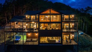 A multi-story cabin with a large balcony, a fireplace, and a dining area. - Outdoor Games, Indoor Games, Incredible Views (SEVIERVILLE)