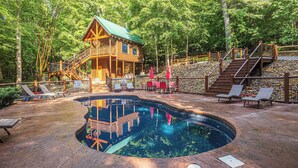 A wooden cabin with a pool, surrounded by trees. - Outdoor Fireplace And Gorgeous Mountain Views (SEVIERVILLE)