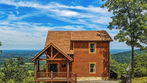 A wooden cabin with a balcony, a satellite dish, and a view of the landscape. - 4 States View-Gatlinburg, Private Pool, Game Room (GATLINBURG)