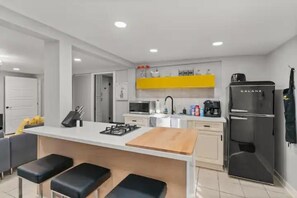 Fridge, microwave, stovetop, coffee/tea maker