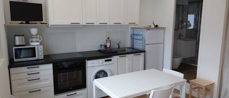 Fridge, microwave, stovetop, coffee/tea maker