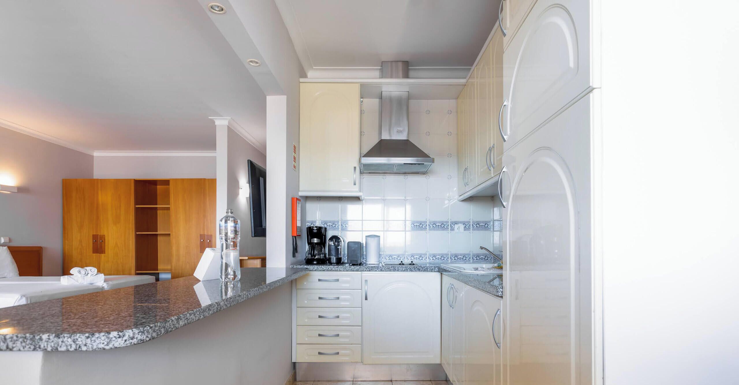 Fridge, microwave, stovetop, coffee/tea maker