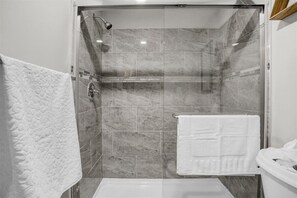 Shower, hair dryer, towels, soap