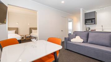 Standard Apartment | Living area | 43-inch Smart TV with cable channels