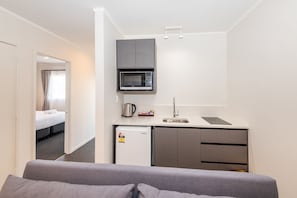 Standard Apartment | Private kitchen | Microwave, stovetop, electric kettle, toaster