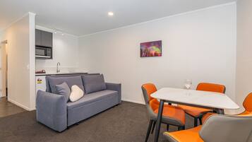 Standard Apartment | Living area | 43-inch Smart TV with cable channels