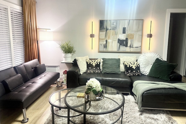 Sufficient space in the living room provides a cozy area for gatherings.