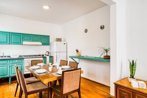 Enjoy meals in this cozy kitchen with an oven, microwave, and ample storage for kitchen essentials.