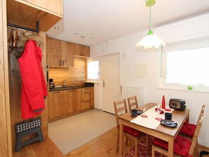 Enjoy cooking in this well-equipped kitchen with a central island and adjacent dining area.