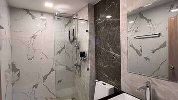 Shower, rainfall showerhead, hair dryer, towels