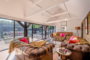 TV, fireplace - The Willows - a holiday let by Bloom Stays that sleeps 8 guests in 4 bedrooms (Ash)