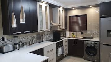 Comfort Apartment | Private kitchen | Full-size fridge, microwave, oven, electric kettle