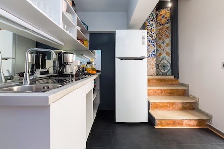 Shared fridge, espresso maker, coffee/tea maker, toaster oven