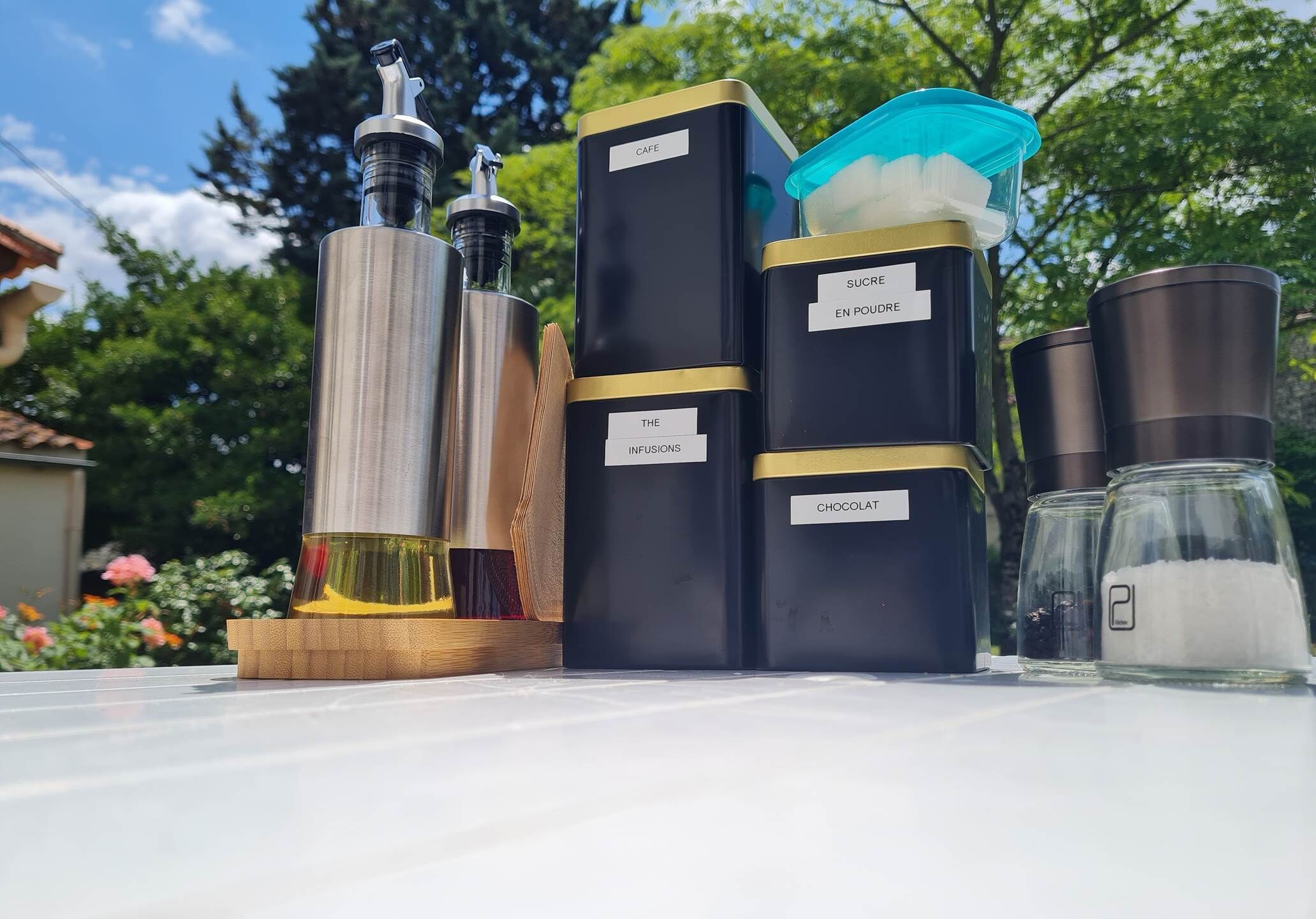 A collection of perfume bottles on a table with labels indicating different scents.
