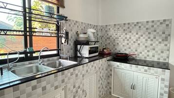 Fridge, microwave, cookware/dishes/utensils