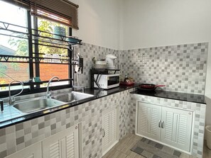 Fridge, microwave, cookware/dishes/utensils