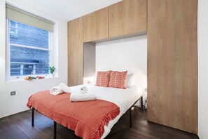 Iron/ironing board, travel crib, free WiFi, bed sheets