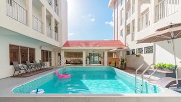 Outdoor pool, open 8:00 AM to 10:00 PM, pool umbrellas, pool loungers