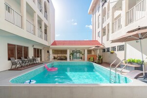 Outdoor pool, open 8:00 AM to 10:00 PM, pool umbrellas, sun loungers