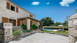 A stone house with a swimming pool, a patio, and a stone wall. - Amazing home in Vrsar (Vrsar)