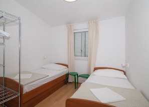 1 bedroom, desk, iron/ironing board, travel crib