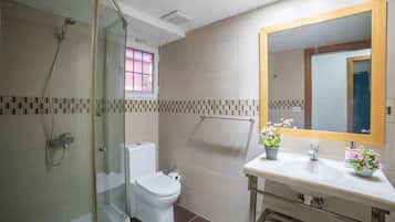 Shower, towels, soap, toilet paper
