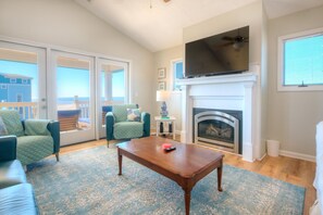 Smart TV, DVD player, books, video library - Coral House: Spacious oceanview retreat in Oak Island, NC, perfect for families. (Oak Island)