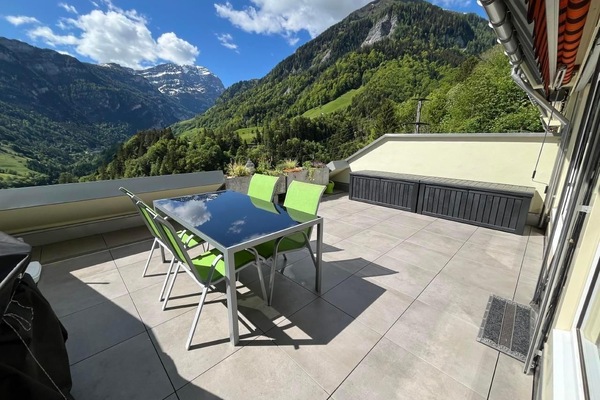 Large sun terrace with panoramic views of the Tamina Valley and the Calanda mountain.