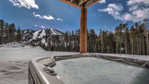 A hot tub in a snowy landscape with a mountain in the background. - Antler Way At Lakota.... 3 Bedroom Townhouse by RedAwning (Winter Park)