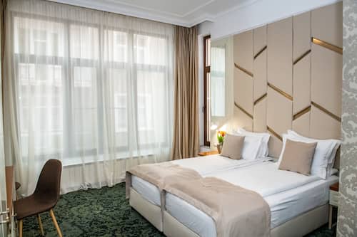 Camera Deluxe con letto matrimoniale o 2 letti singoli | Una scrivania, postazione laptop, insonorizzazione, Wi-Fi gratuito