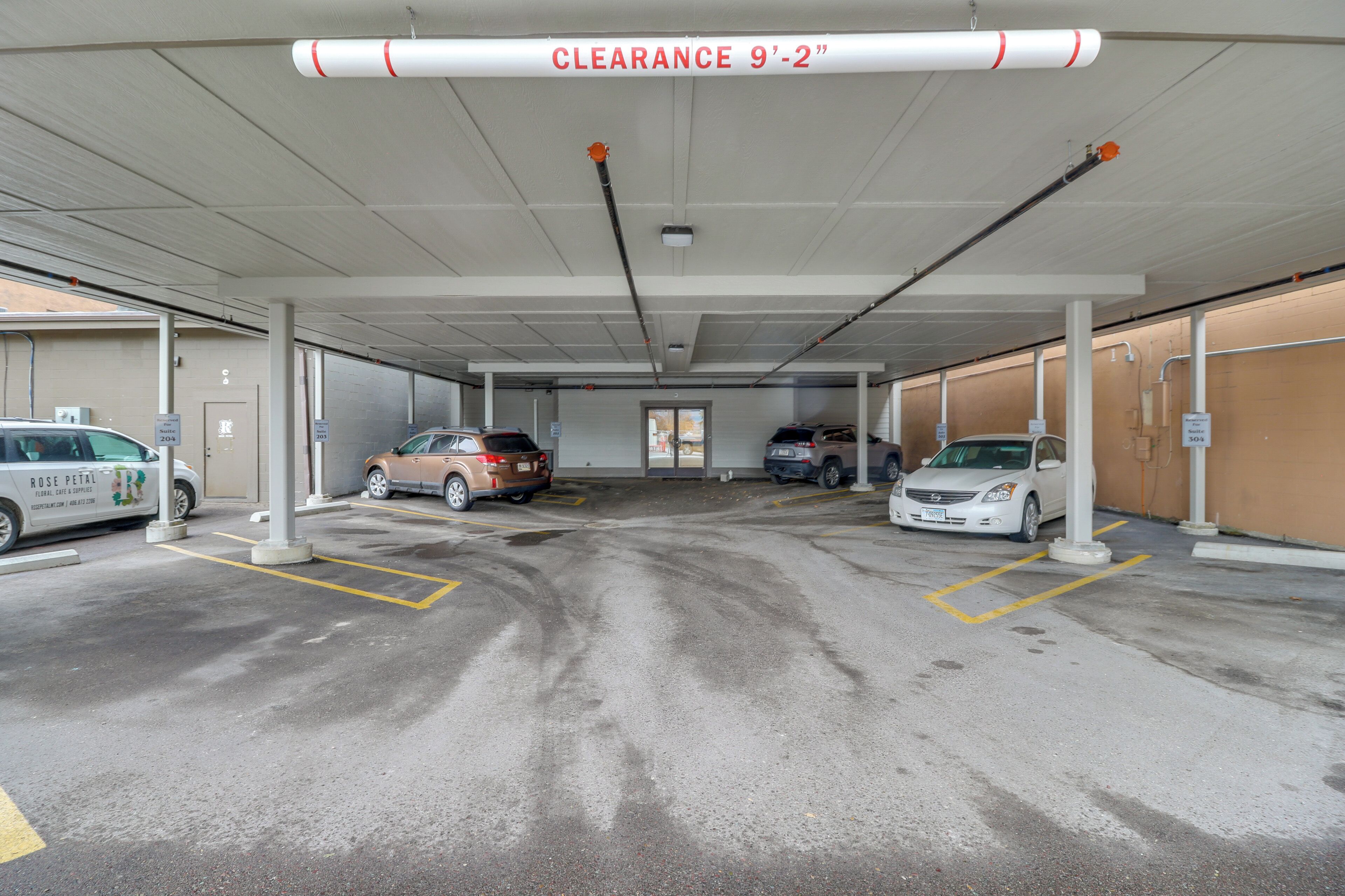 A parking garage with clear signage indicating a 9'-2" clearance.