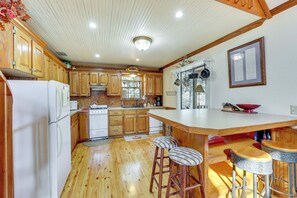 Enjoy cooking in this well-equipped kitchen with a central island and ample storage.