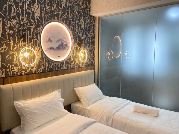 Habitación Deluxe con 2 camas individuales | Escritorio, insonorización, wifi gratis y ropa de cama