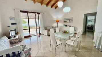 Villa | Living area | 35-inch TV with digital channels