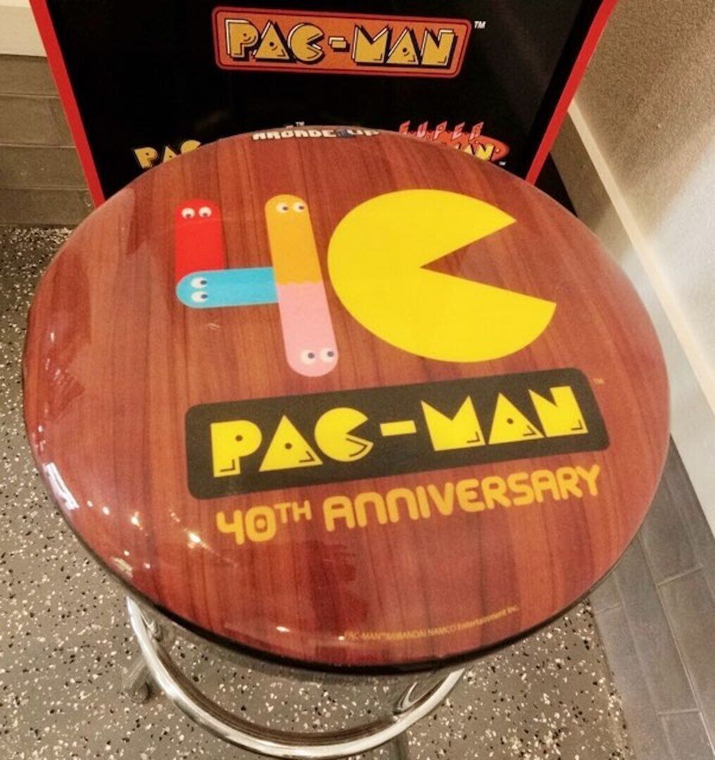 A wooden seat with a Pac-Man logo and "40th Anniversary" text.