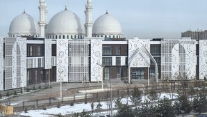 A modern building with three domes and a patterned facade. - Shymkent Park Hotel (Shymkent)