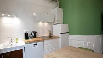 Fridge, microwave, coffee/tea maker, cookware/dishes/utensils