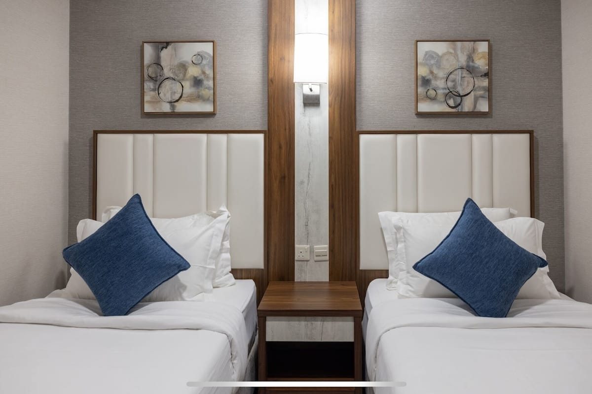 Phòng Suite Deluxe, 2 phòng ngủ | Bộ trải giường bằng vải Frette của Ý, bộ đồ giường cao cấp